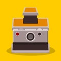 Vintage retro foldable compact camera flat style isolated icon with shadow in yellow background Royalty Free Stock Photo