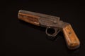 Vintage retro handgun pistol isolated on black background Royalty Free Stock Photo
