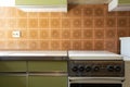 Vintage retro kitchen with orange pattern tiles, american retro kitchen home interior design 70's style Royalty Free Stock Photo