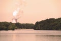 vintage retro lake view nuclear power atomic energy plant steam sepia photograph industrial landscape environmental background