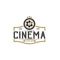 Vintage Retro Logo Style for Cinema Studio Production Logo. With film reel stripes, and filmstrip roll tapes