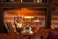 Vintage retro phone with rotary dial in interior on the brick wall and wooden shelves. Royalty Free Stock Photo