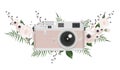 Vintage retro photo camera in flowers, leaves, branches on white background Royalty Free Stock Photo