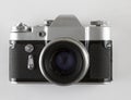 Vintage retro photo camera isolated on the white background  close-up front  view Royalty Free Stock Photo