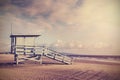 Vintage retro picture of wooden lifeguard tower, Beach in California, USA. Royalty Free Stock Photo