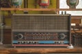 Vintage Retro Radio Transistor on the Wood Shelf. Old Media Sound and Music Equipment