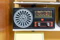 Vintage retro radio on wooden shelf. Retro technology