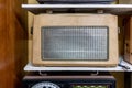 Vintage retro radio on wooden shelf. Retro technology