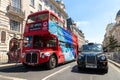 Vintage retro Red double decker bus and black taxi (Cab) in London, England, UK Royalty Free Stock Photo