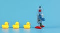 Vintage retro robot and Yellow Rubber Bath Ducks, leadership