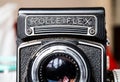 Vintage retro Rolleiflex photo camera front view lens and logo detail
