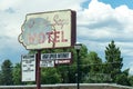 Vintage retro sign for the Purple Sage Motel. Lodging has vacancy. J Royalty Free Stock Photo