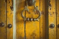 vintage retro style yellow wood door. old brass doorknob. abstract background
