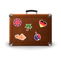 Vintage retro suitcase with travel stickers. Old leather luggage bag with stickers of France, Germany, Egypt, UK Royalty Free Stock Photo