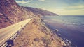 Vintage retro toned scenic Pacific Coast Highway, California. Royalty Free Stock Photo