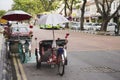 Vintage retro tricycle bike or rickshaw of Malaysian people riding service traveller