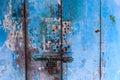 Vintage retro wooden door and slide lock. Home interior architectural design, plain tropical blue painted texture wood panel board Royalty Free Stock Photo