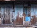 Vintage retro wooden door and slide lock. Home interior architectural design, plain tropical blue painted texture wood panel board