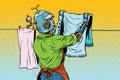 Vintage robot employee hangs up to dry clothes