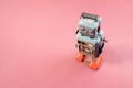 Vintage robot tin toy on pink background Royalty Free Stock Photo