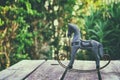 Vintage rocking horse over wooden table outdoors