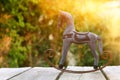 Vintage rocking horse over wooden table outdoors