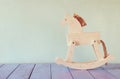 Vintage rocking horse on wooden floor. retro filtered image Royalty Free Stock Photo