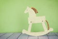 Vintage rocking horse on wooden floor. retro filtered image Royalty Free Stock Photo