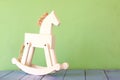 Vintage rocking horse on wooden floor Royalty Free Stock Photo