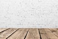 Vintage room interior. Old white brick wall and wooden floor background texture. Space for your background placement or products. Royalty Free Stock Photo