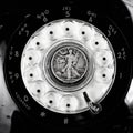 Vintage rotary dial phone with old silver coin Royalty Free Stock Photo