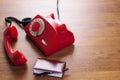 Vintage rotating red disc phone and phone book