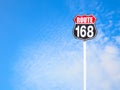 Vintage route 168 road sign and blue sky