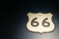 Vintage Route 66 shield sign on dark background