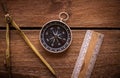 Vintage rule, drawing and navigational Compass on a rustic wooden board Royalty Free Stock Photo