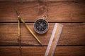 Vintage rule, drawing and navigational Compass on a rustic wooden board Royalty Free Stock Photo
