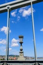 Vintage rusted lighting pole with clear blue sky in the background on SzÃÂ©chenyi Chain Bridge over Danube in Budapest, Hungary Royalty Free Stock Photo