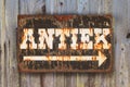 Vintage rusted sign with the Dutch word `Antique` Royalty Free Stock Photo