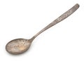 Vintage rusted silverware, old decorated spoon isolated on a white, top view, close up