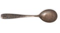 Vintage rusted silverware, old decorated spoon isolated on a white, top view, close up