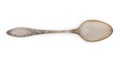 Vintage rusted silverware, old decorated spoon isolated on a white, top view, close up