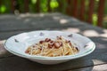 Vintage rustic plate with delicious spagetti carbonara. Royalty Free Stock Photo