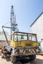 Vintage rusty crane vehicle. Old industrial truck with mounted crane Royalty Free Stock Photo