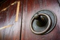 Vintage rusty doorknob on wooden classic door Royalty Free Stock Photo