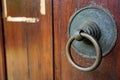 Vintage rusty doorknob on wooden classic door