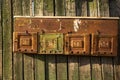 Vintage rusty mailbox on a wooden fence. Rural Route Delivery