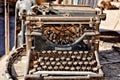 Vintage rusty typewriter on a barrel Royalty Free Stock Photo