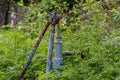 Vintage rusty water fountain hand pump in russian village. Abandoned water wellhead Royalty Free Stock Photo