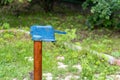 Vintage rusty water fountain hand pump in russian village. Abandoned water wellhead Royalty Free Stock Photo