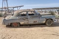 vintage 40\'s large saloon-car worn down by rust in exibition at Canyon Roadhouse, Namibia